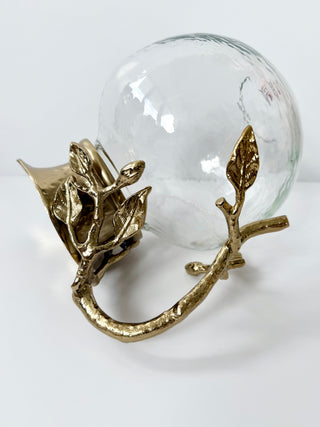 Glass Pitcher Adorned With A Gold Metal Handle