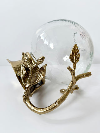 Glass Pitcher Adorned With A Gold Metal Handle