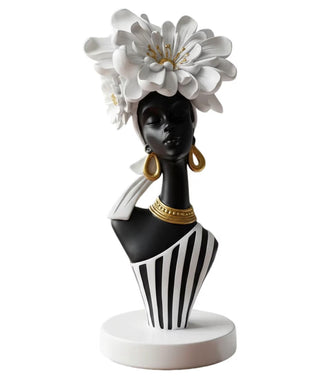 Artistic Sculpture Depicting an African Woman Crowned with White Flowers; Black-and-White Art Statue