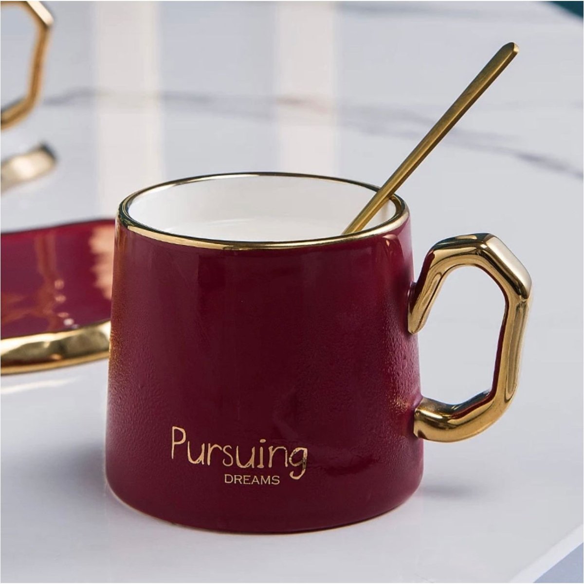 https://designedbytheboss.com/cdn/shop/products/ceramic-coffee-mug-saucer-set-with-gold-spoon-125547.jpg?v=1695798065