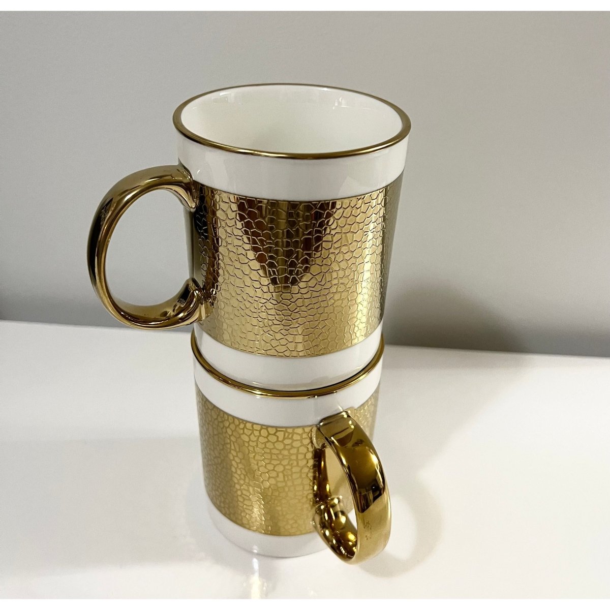 https://designedbytheboss.com/cdn/shop/products/luxury-white-gold-silver-plated-coffee-mugs-298509.jpg?v=1695798289